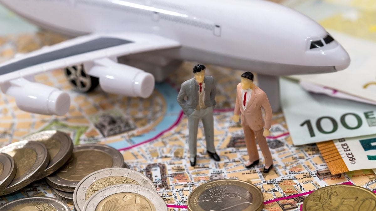 Airplane with map euro and miniature toy people