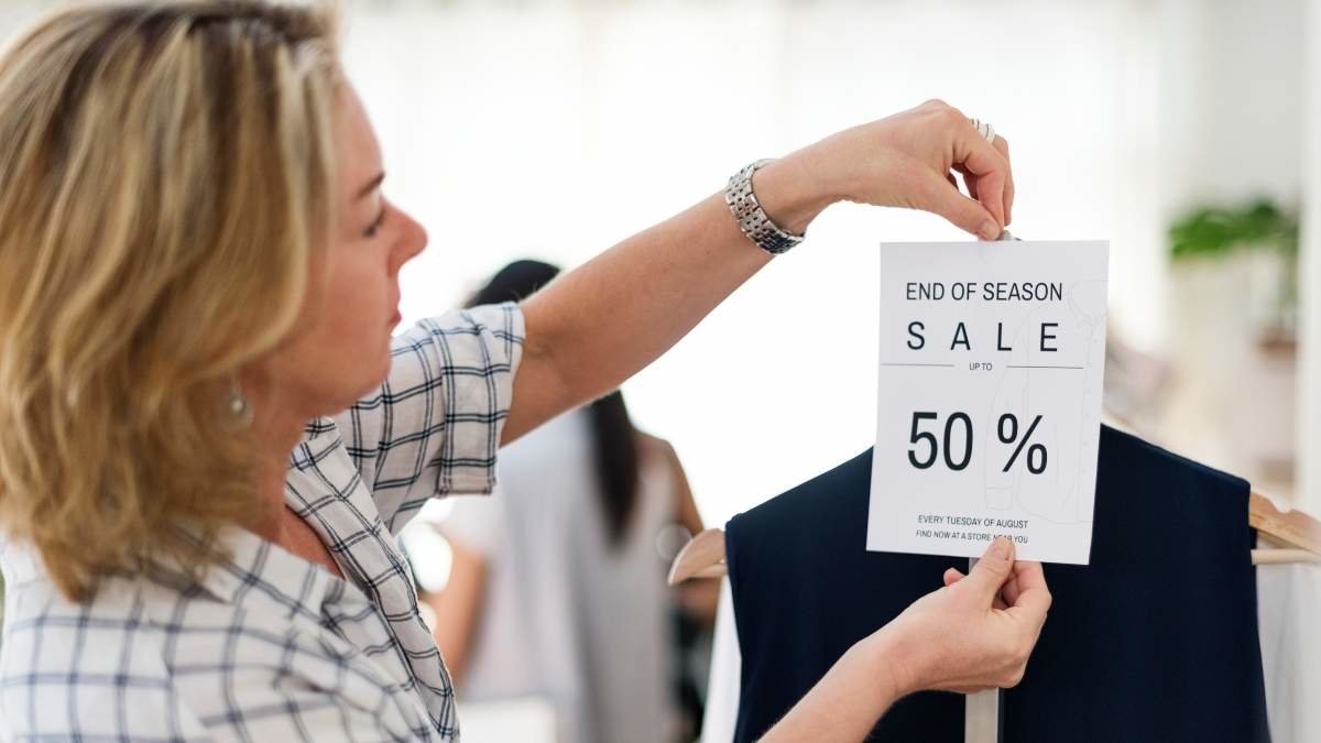 Woman with 50 percent sale sign