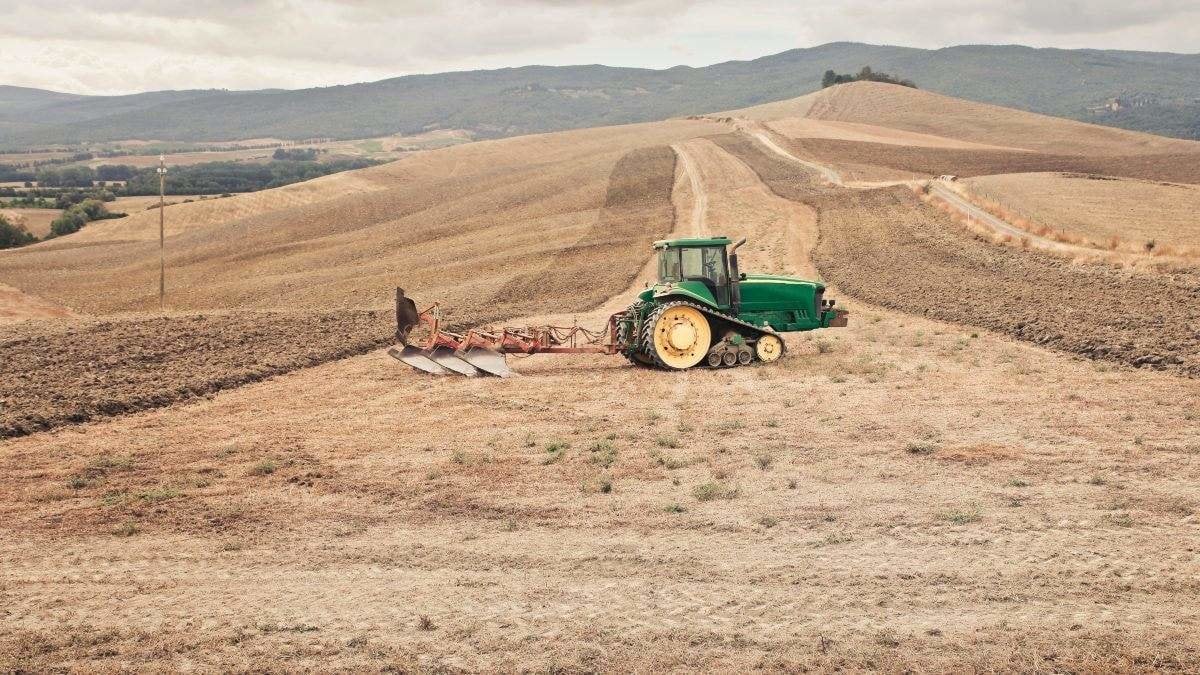 tractor in the countryside, tuscany , italy