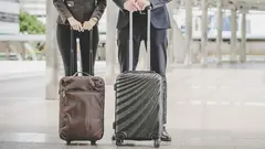 Business man and woman are going on business trip.
