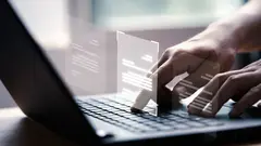 Hand using laptop computer with virtual screen and document for online approve paperless quality assurance and ERP management concept.
